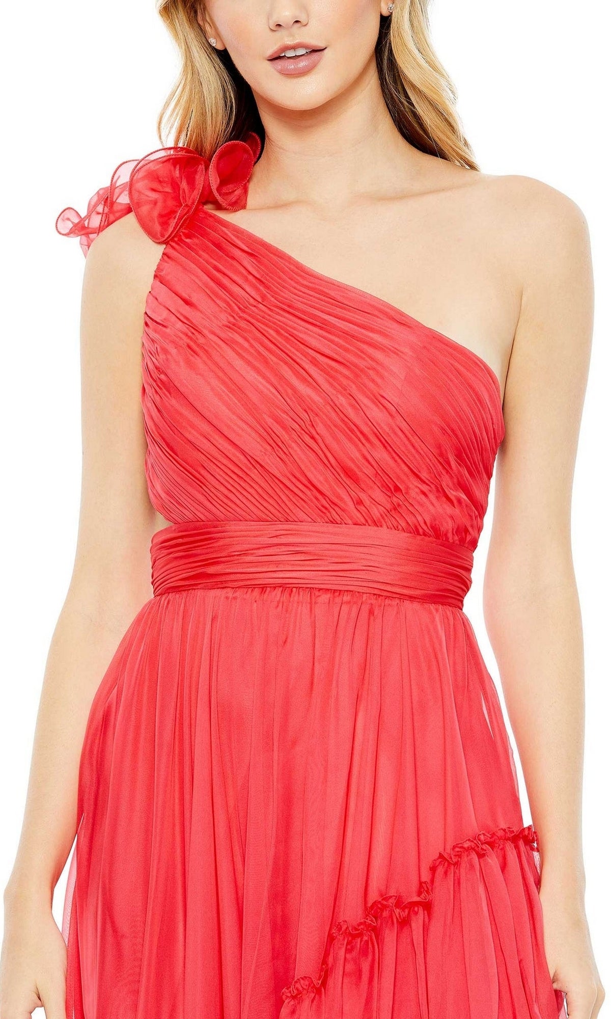 A woman wearing the Long Formal Dress 67989 by Mac Duggal in red, featuring pleated fabric and a ruffled one-shoulder design, stands against a white background.